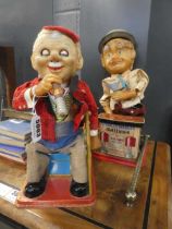 A Charley Weaver bartender battery operated figure, a similar figure and a Noddy money box (3)