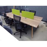 Large rectangular wood effect office table complete with green privacy screens and 4 blue and