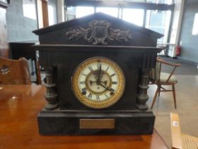 slate mantel clock with columns to the side