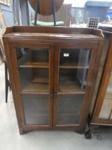 Glazed oak double door bookcase