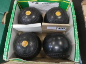 Four lawn bowls