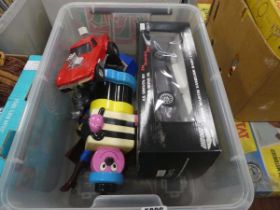 Box containing Bassetts liquorice figure, toy cars, Superman figures, and Star Wars character