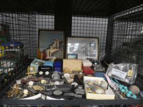 Cage containing wristwatches, pictures, coinage and cars