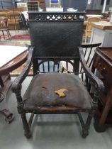 Carved armchair with leather seat and back rest