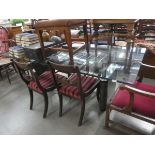 Large glass dining table with metal base