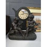 Quartz mantle clock with cherub figures