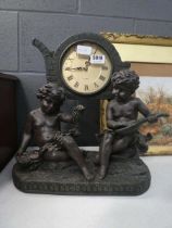 Quartz mantle clock with cherub figures