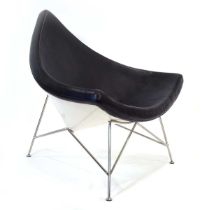 After George Nelson, a 'Coconut' style lounge chair, the white fibreglass shell with a black