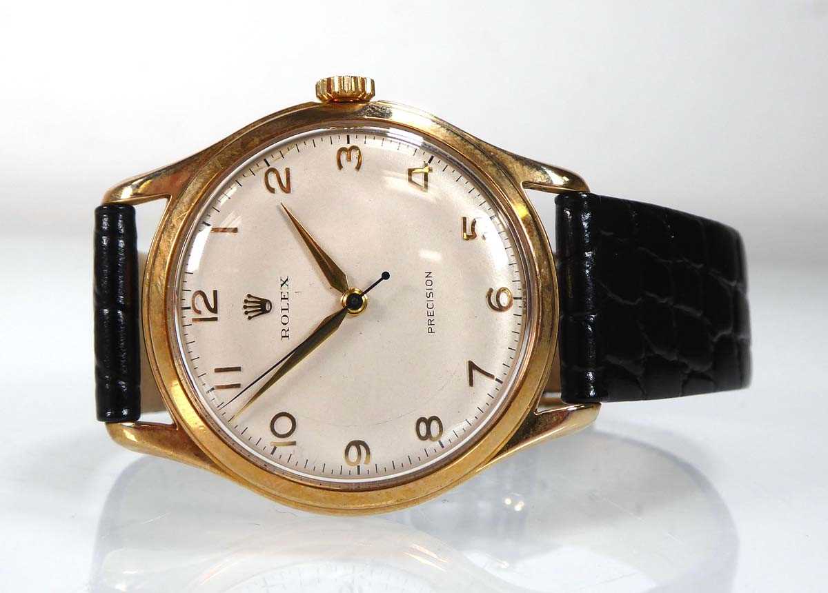 A 1970's gentleman's 9ct yellow gold wristwatch by Rolex, the circular dial with gold coloured