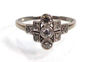 An early 20th century 18ct white gold ring set nine small diamonds in a Deco style setting, ring