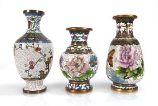 A miniature finely-decorated cloisonné vase, h. 16 cm, together with two similar vases (3)