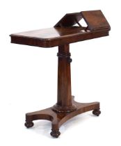 A Victorian mahogany double-sided adjustable reading or music table with two ratchet mechanisms,