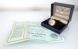 A gentleman's 9ct yellow gold wristwatch by Garrard, the circular dial with baton numerals and