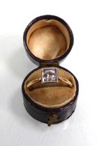 An early 20th century 18ct yellow gold ring set brilliant cut diamond in a square setting, stone