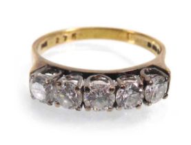An 18ct yellow gold ring set five brilliant cut diamonds in an inline setting, London 1980, total