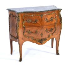 A 20th century bombe chest, the marble surface over a walnut 'sunburst' body with brass mounts,