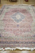 An Indian woollen carpet, 348 x 242 cm