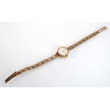A ladies 9ct yellow gold wristwatch by Rotary, the circular dial with baton numerals on an