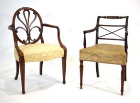 A George III mahogany elbow chair in the manner of Gillows, with an oval back, together with another