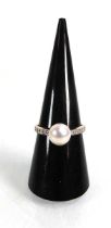 A 14ct yellow gold ring set cultured pearl and small diamonds, pearl d. 8 mm, ring size N, 2.4 gms