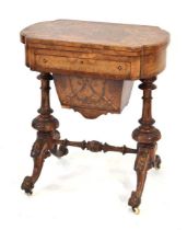 A Victorian walnut and marquetry games table, the surface swivelling to reveal various boards,