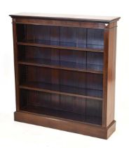 A Victorian mahogany open-fronted bookcase with three adjustable shelves, on a plinth base, w. 107