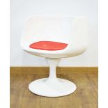 After Eero Aarnio, a 'Cognac' style lounge chair with a white moulded body and loose red cushion