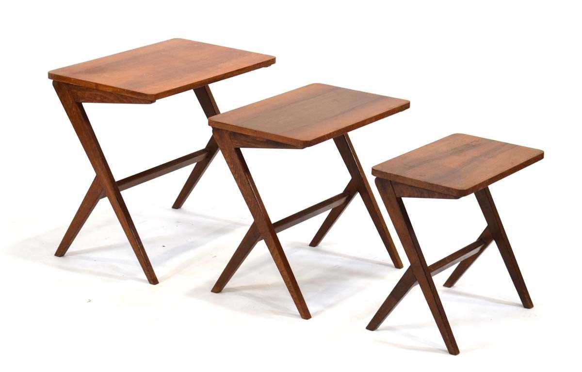 A nest of three 1950's Swedish 'Walking' occasional tables in walnut designed by Bengt Ruda, max. 54