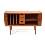 A 1970's Danish teak tambour music cabinet by Vantinge Mobelindustri, on later turned legs,