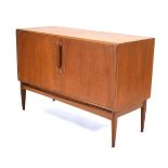 A 1960/70's McIntosh Furniture teak sideboard, the two doors with moulded handles, on triangular