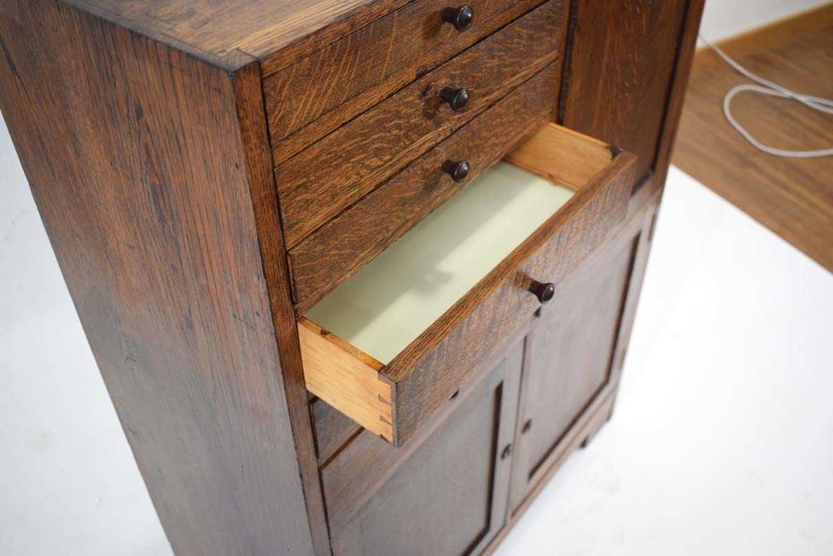 A 1930's oak dentist's cabinet with an arrangement of doors and drawers, 77 x 32 x 106 cm *A similar - Image 3 of 3