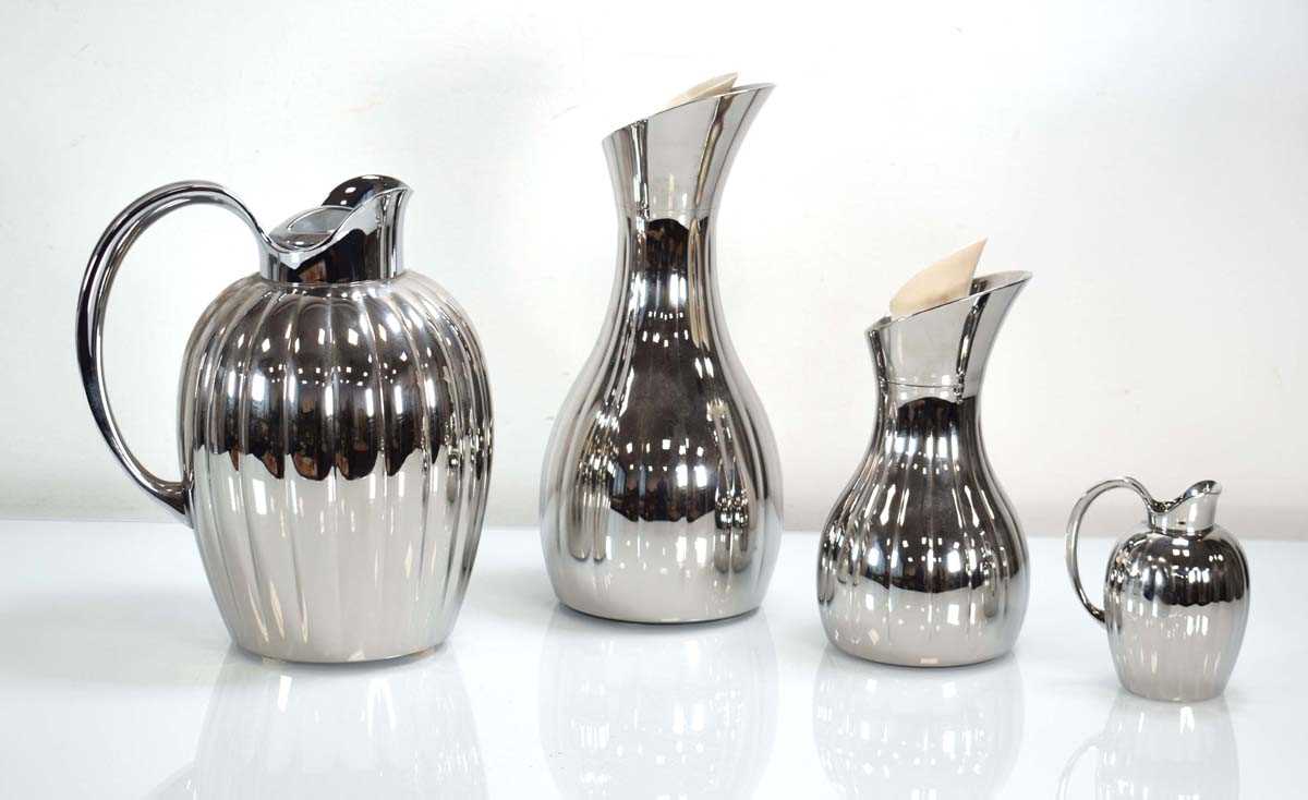 A Georg Jensen 'Bernadotte' Range thermos jug, together with two matching carafes and a milk jug (4)
