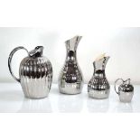 A Georg Jensen 'Bernadotte' Range thermos jug, together with two matching carafes and a milk jug (4)