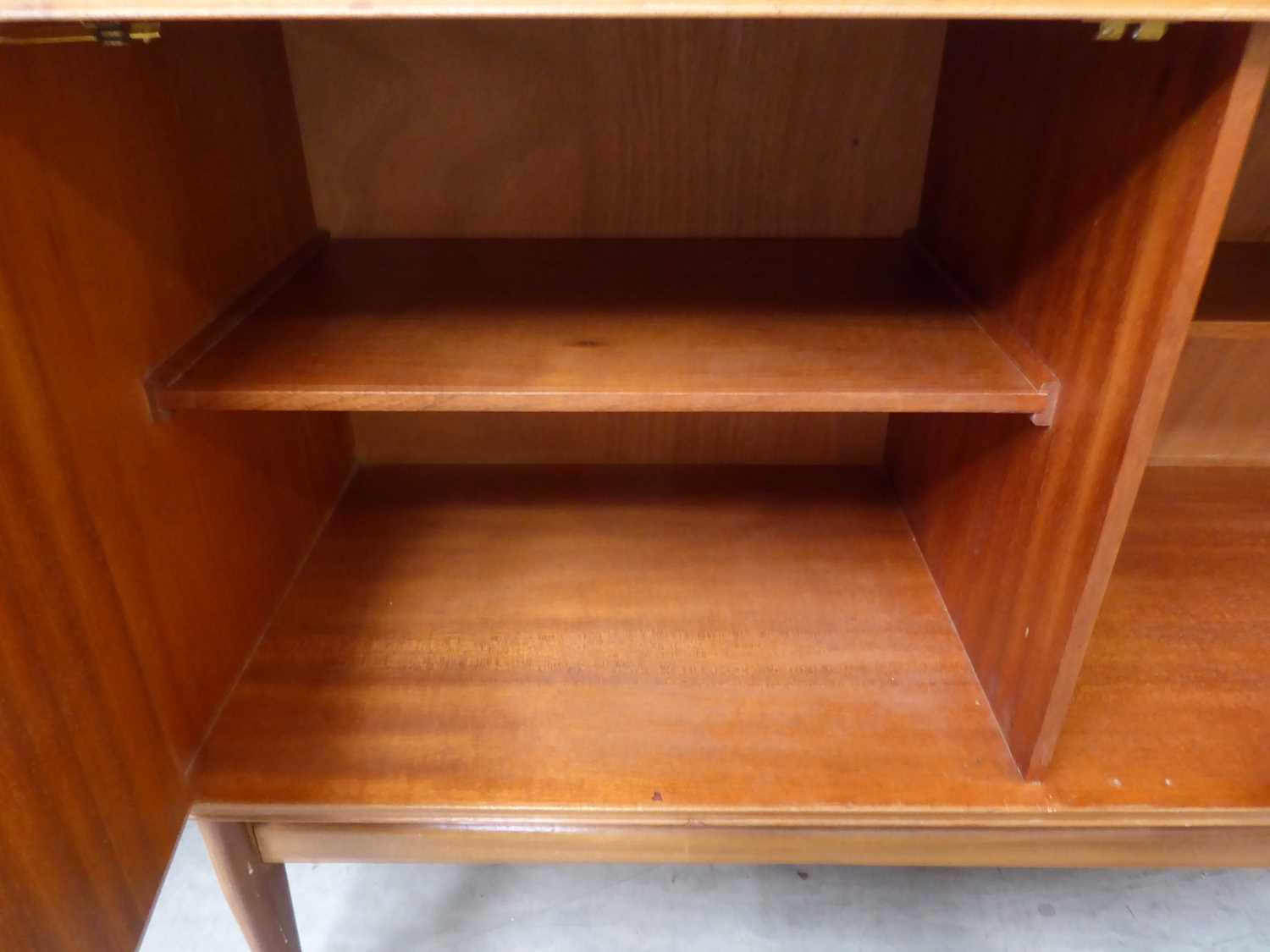 A 1960/70's McIntosh Furniture teak sideboard, the two doors with moulded handles, on triangular - Image 5 of 6