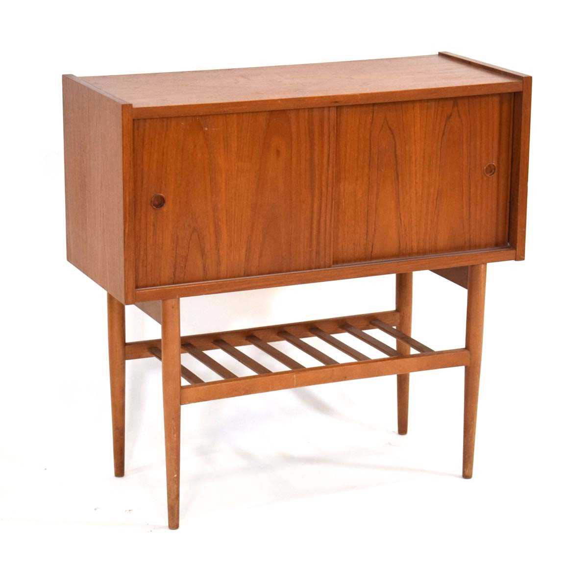 A 1960's Danish teak cabinet with two sliding doors over a slatted tier, on tapering legs, w. 80 cm,