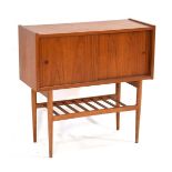 A 1960's Danish teak cabinet with two sliding doors over a slatted tier, on tapering legs, w. 80 cm,