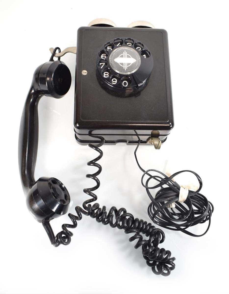A 1950's Swiss bakelite wall-mounted telephone by Weidmann