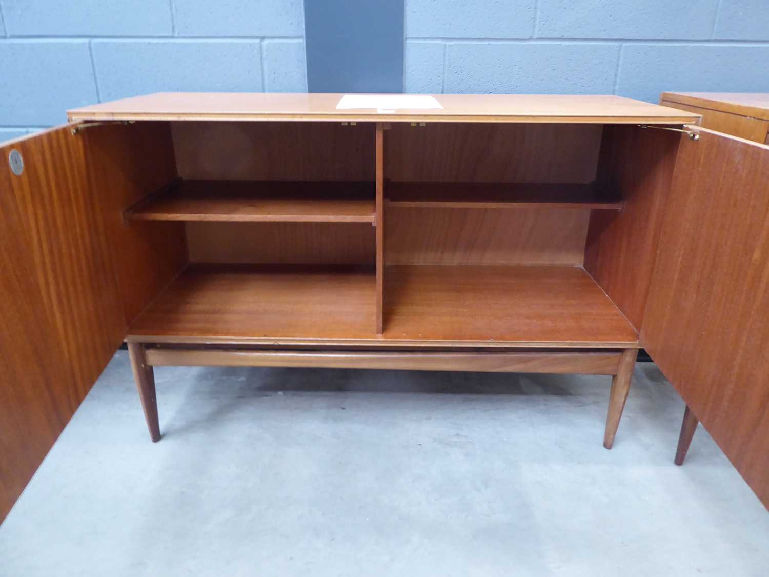 A 1960/70's McIntosh Furniture teak sideboard, the two doors with moulded handles, on triangular - Image 4 of 6