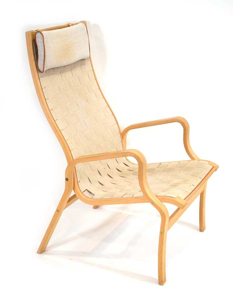 A 1960's Danish beech bentwood armchair with a webbed seat, designed by Finn Ostergaard