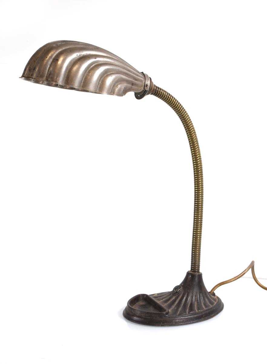 A 1930's "Supreme" 'Entirely British Made' desk lamp with a shell-shaped shade and adjustable neck