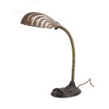 A 1930's "Supreme" 'Entirely British Made' desk lamp with a shell-shaped shade and adjustable neck