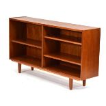 A 1960/70's teak open-fronted bookcase with adjustable shelves, on later turned legs, 138 x 30 x