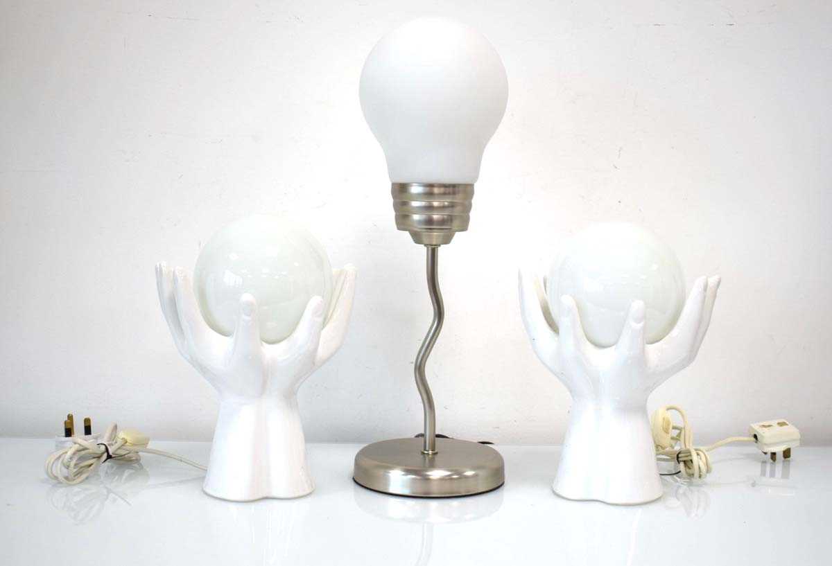 A pair of 1990's 'hand' lamps with globular shades together with a further contemporary table lamp