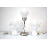 A pair of 1990's 'hand' lamps with globular shades together with a further contemporary table lamp