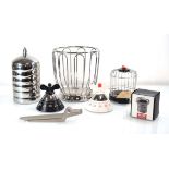 A group of Alessi kitchen items including two timers, a 'Sweetheart' crocodile nutcracker, a '