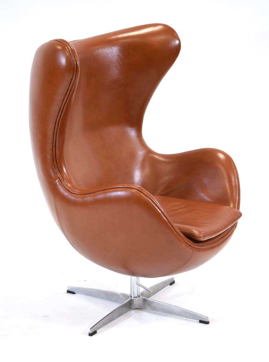 After Arne Jacobsen, an 'Egg' chair upholstered in brown leather on a four-star chromed base *Sold - Image 2 of 2