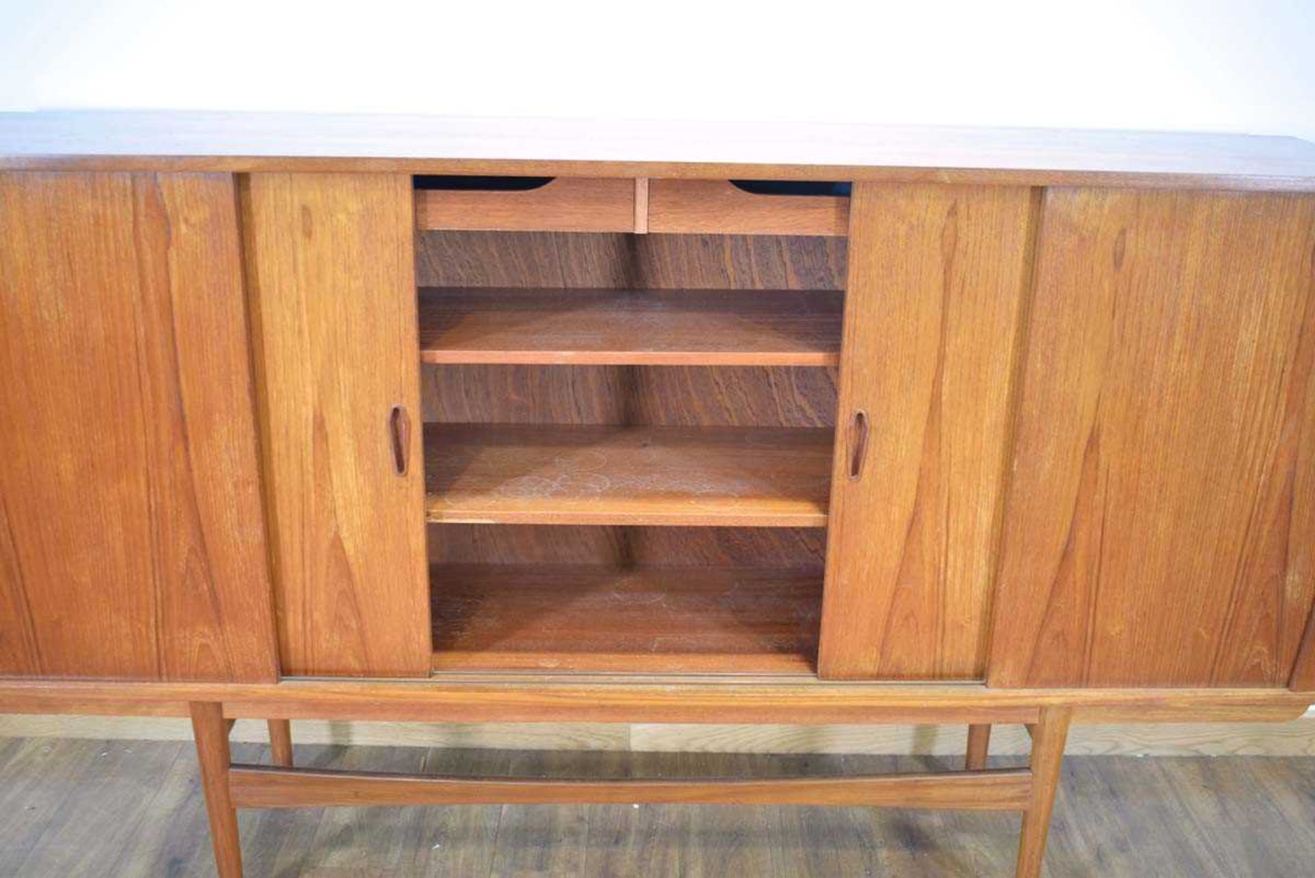 A 1960's Danish teak sideboard cabinet, the four sliding doors enclosing an arrangement of - Image 3 of 3