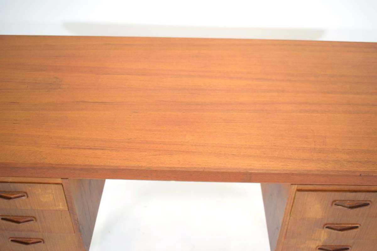 A 1960's Danish teak and crossbanded kneehole desk, the rectangular surface over six drawers with an - Image 3 of 3
