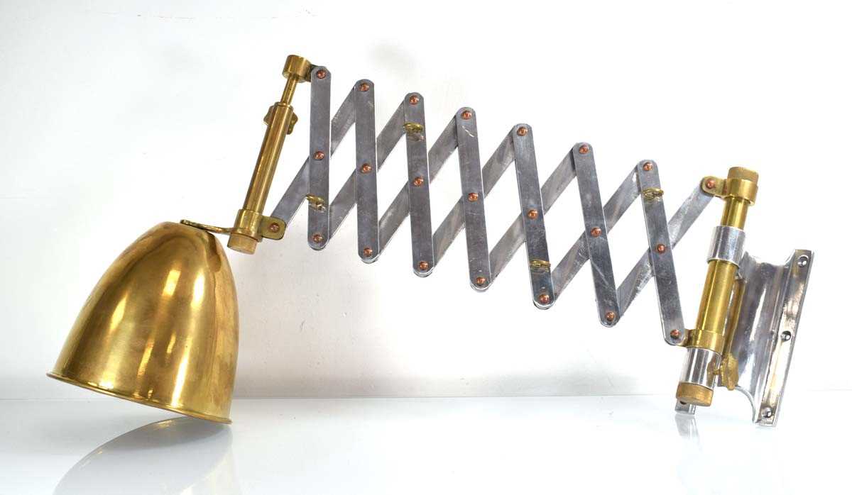 A late 20th century scissor-arm wall light with brass and copper highlights