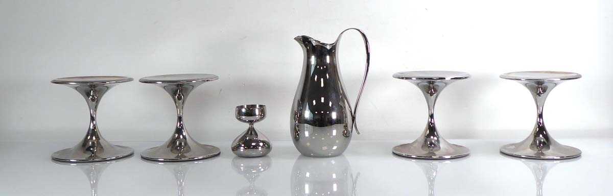 A group of Robert Welch stainless steel tablewares including four tazzas, a candlestick and a